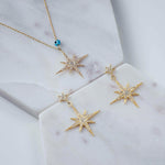 Petite Star Burst Drop Earrings Gold.