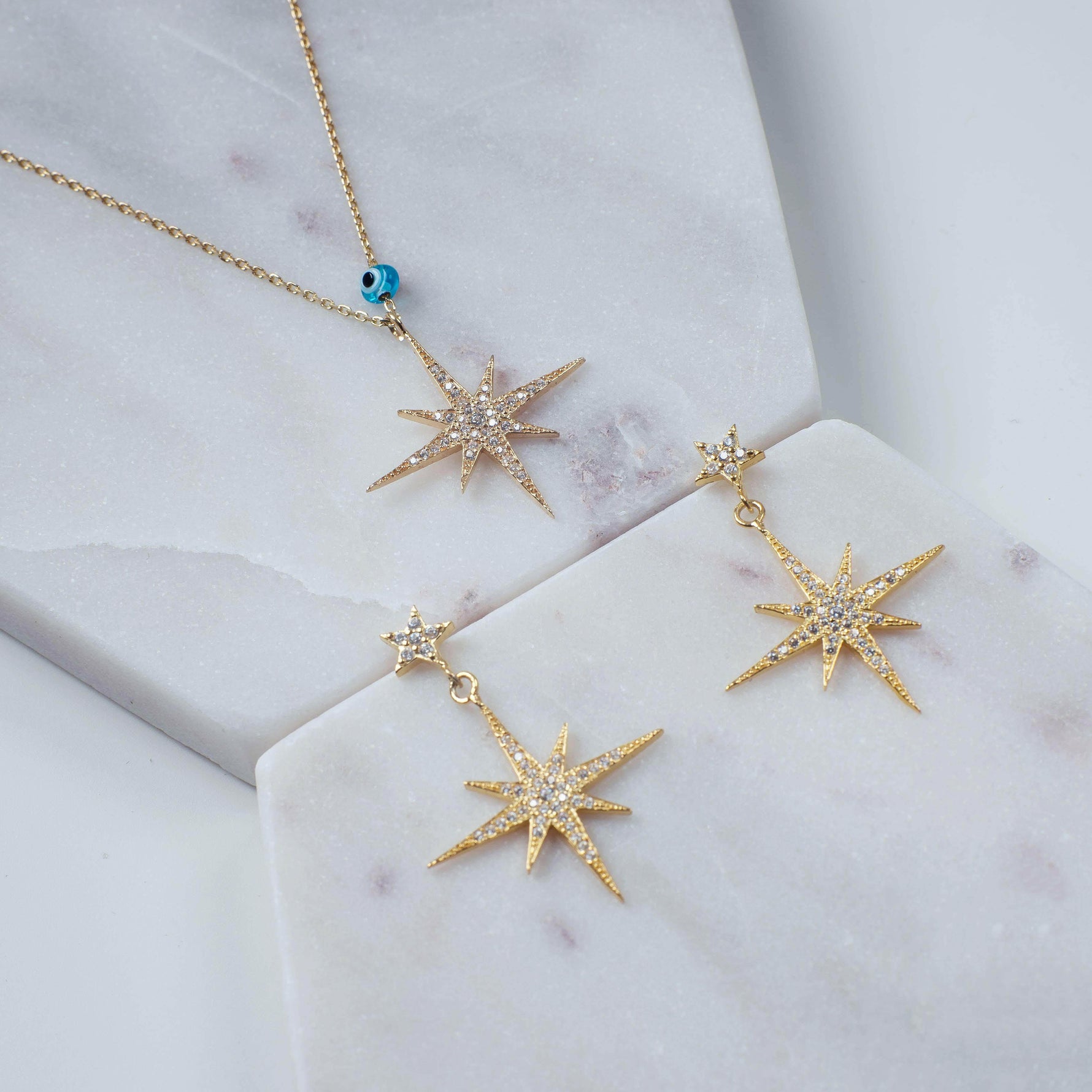 Petite Star Burst Drop Earrings Gold.