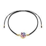 Flower bracelet | Black woven bracelet with gold-plated flower charm.