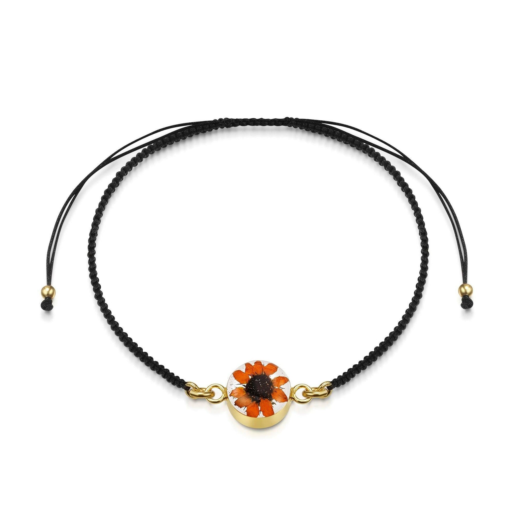 Flower bracelet | Black woven bracelet with gold-plated flower charm.