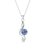 Treble clef musical note necklace with real forget-me-not flowers.